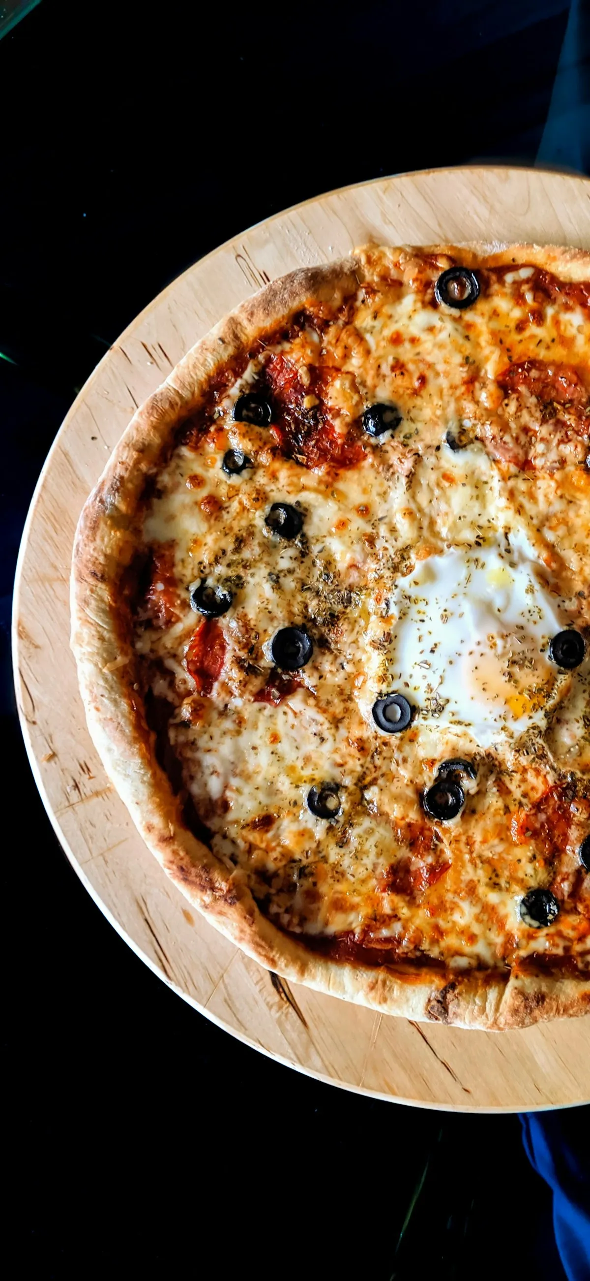 Pizzaiolo stretching fresh dough by hand